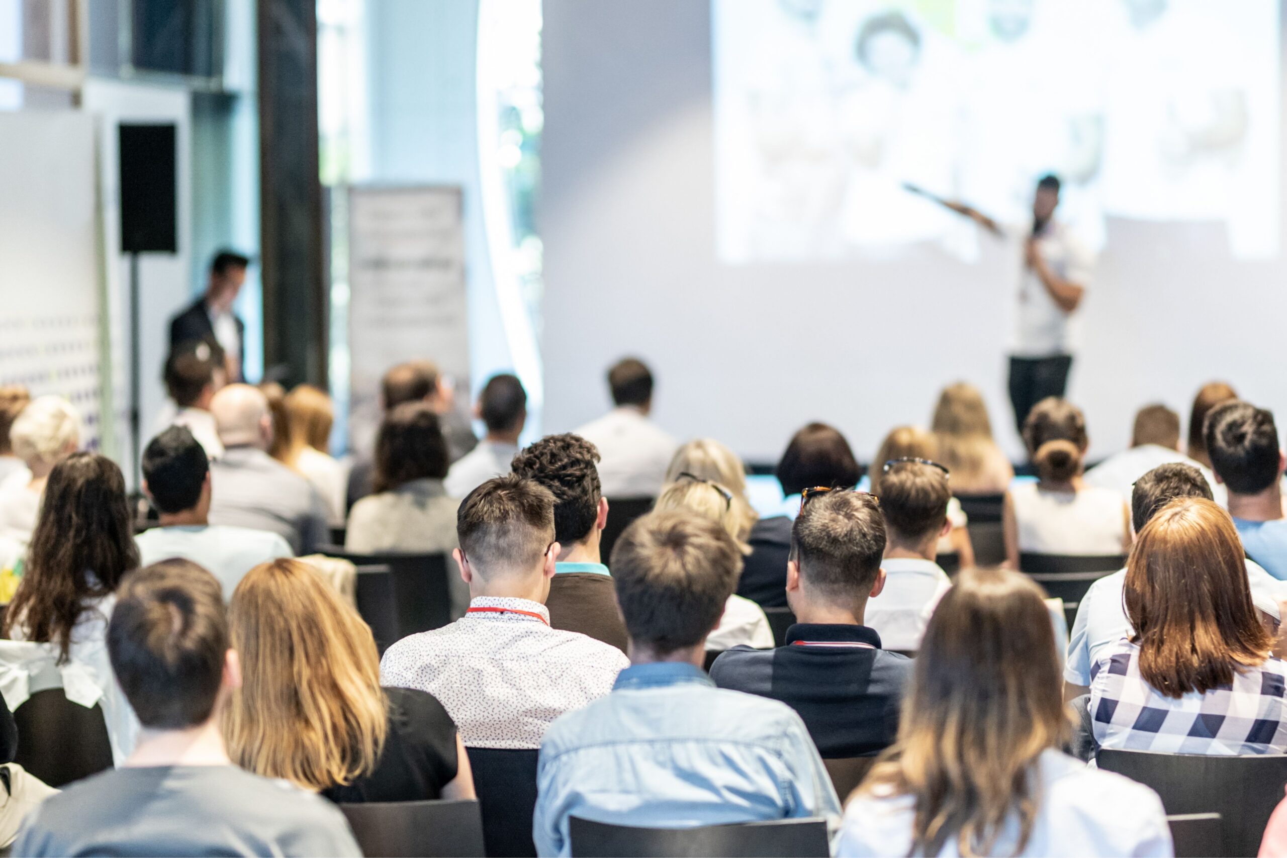 Professional networking events in modern European conference center with business attendees