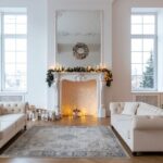 Minimalist Scandinavian Christmas tree decorated with white ornaments, natural wood accents, and warm fairy lights representing Nordic hygge decor style with simple elegant festive touches