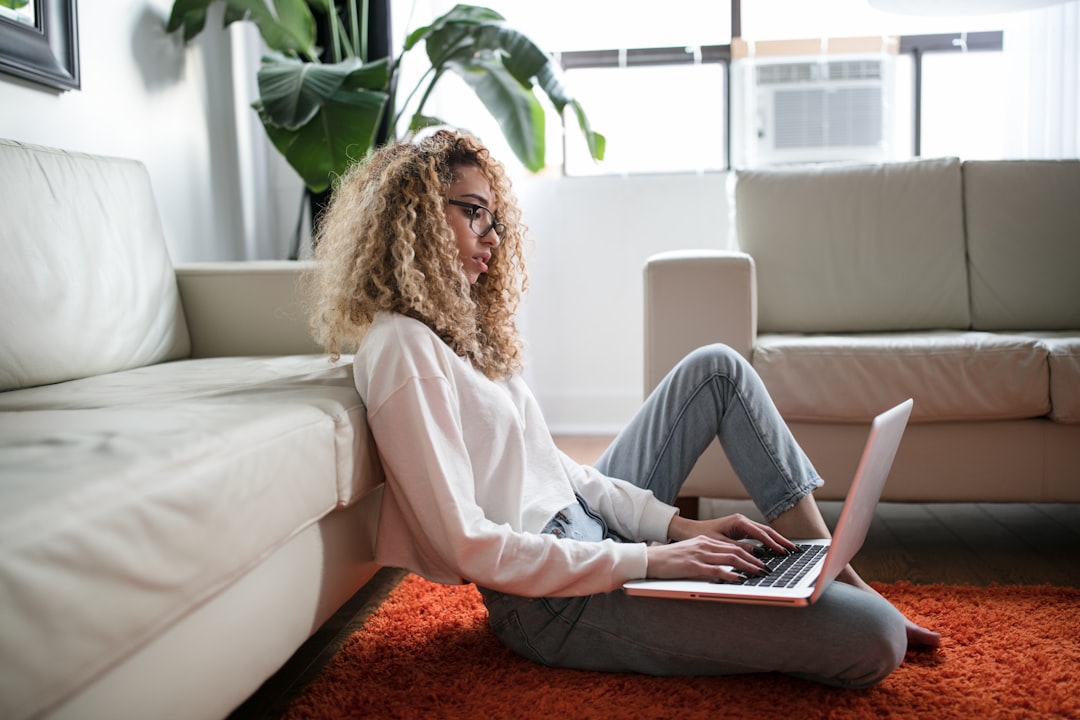 A woman reviewing her EU consumer rights after completing an online purchase on her laptop at home