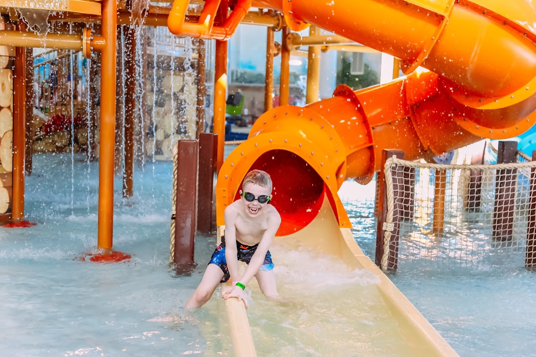 A family enjoying a thrilling water slide at one of Europe's top aqua parks on a sunny summer day