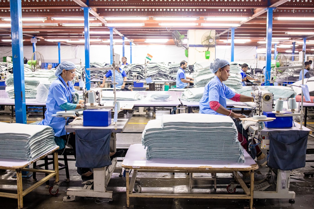 A worker sorting garments at a textile recycling centre, part of the EU's growing circular collection infrastructure