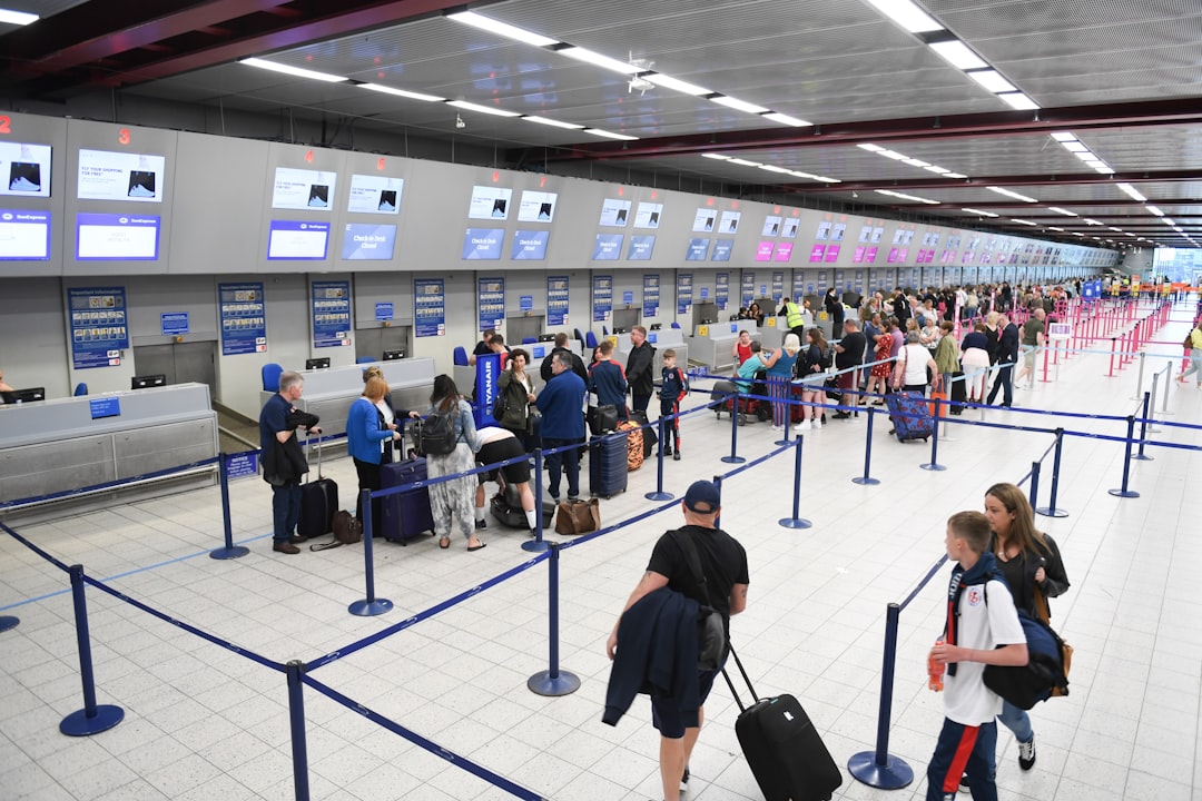 travellers holding passport at an EU airport border, reflecting the changes agreed at the EU–UK summit on eGate access
