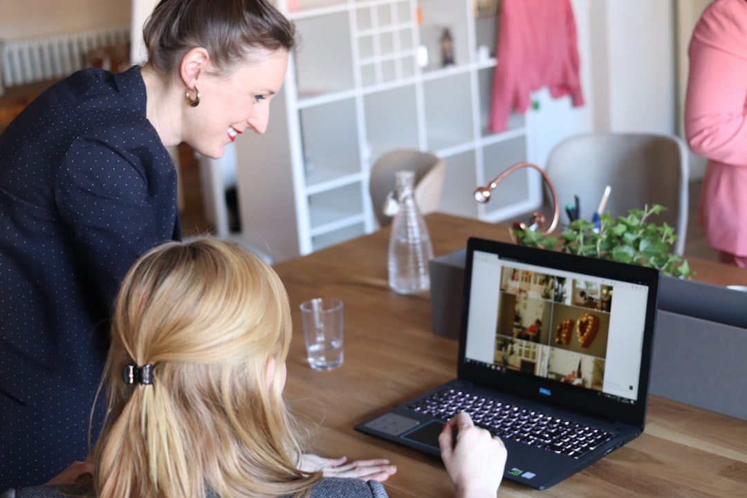 A female founder reviews cross-border e-commerce compliance data on her laptop in a bright European office