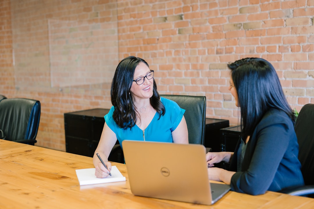 A financial adviser explains ELTIF 2.0 investment options to a retail investor during a one-to-one meeting