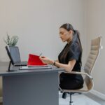 A procurement manager reviews EU supplier contracts at her desk before Q4 negotiations begin