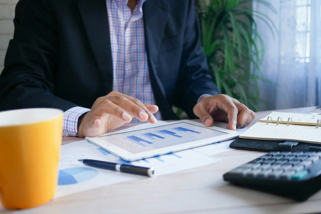 Investor reviewing earnings season results on a laptop